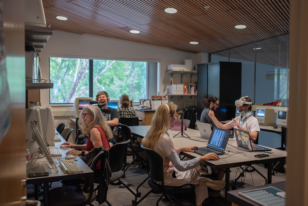 students and researchers work together in electronic literature lab's reading room
